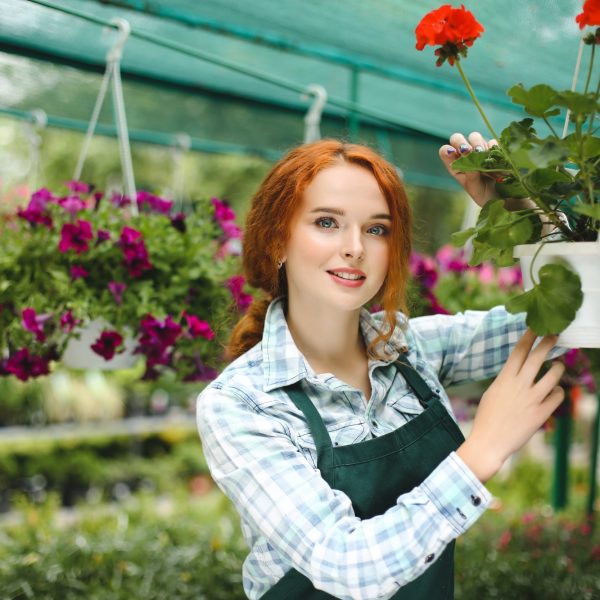 beautiful-florist-in-apron-working-with-flowers.jpg